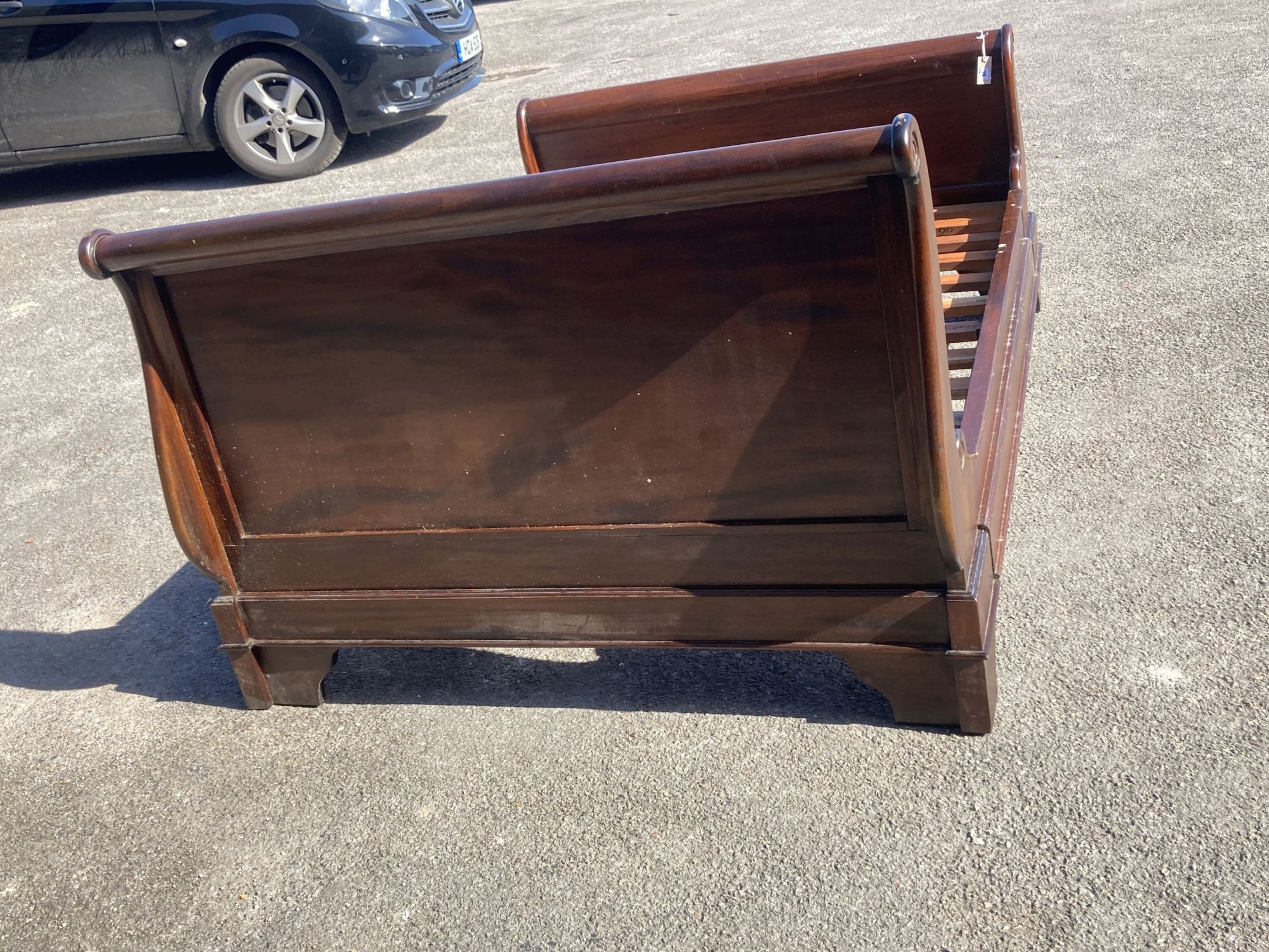 A reproduction mahogany sleigh bed, width 145cm, length 205cm